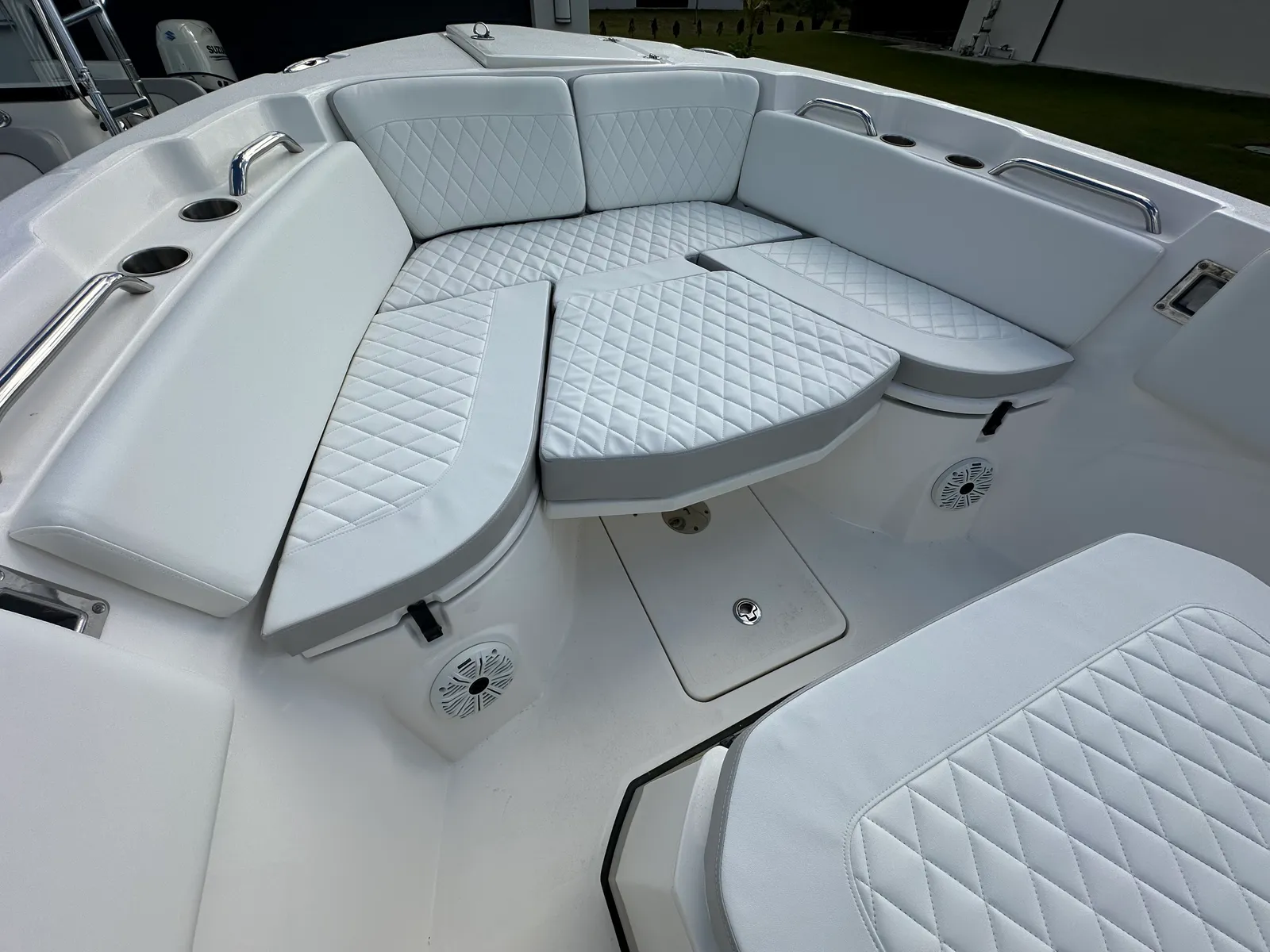White diamond-stitched bow cushions on a boat, upholstered by GVO Classic Upholstery in North Port, FL